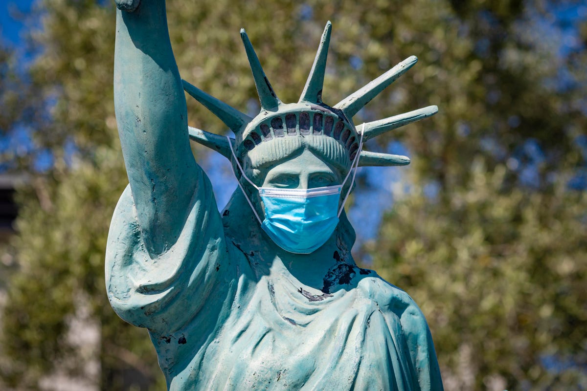 Statue of Liberty wearing a face mask