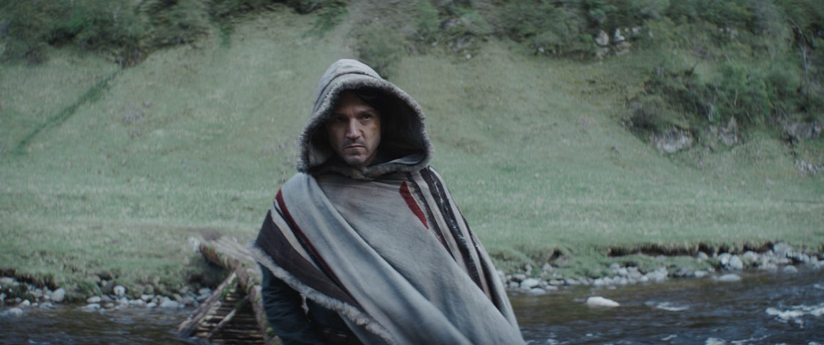 Cassian Andor wears a poncho and looks intense in Andor