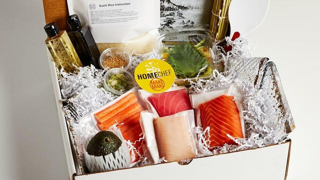 raw fish and sushi-making ingredients in shipping box