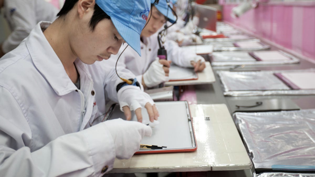 A shot of a worker from Apple's annual report.