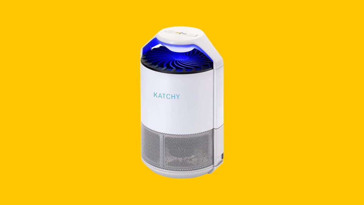 A Katchy Indoor Insect Trap with UV light and fan is displayed against a yellow background.