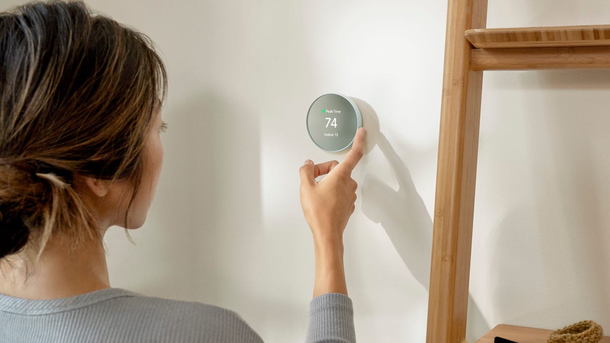 person-adjusting-thermostat-1