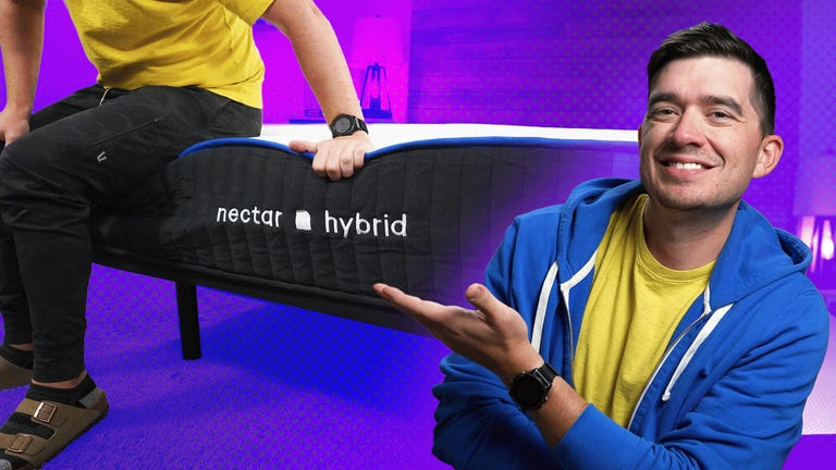 The Nectar Hybrid mattress with a man sitting on the bed against a colorful background with a man in a blue sweatshirt in the front.
