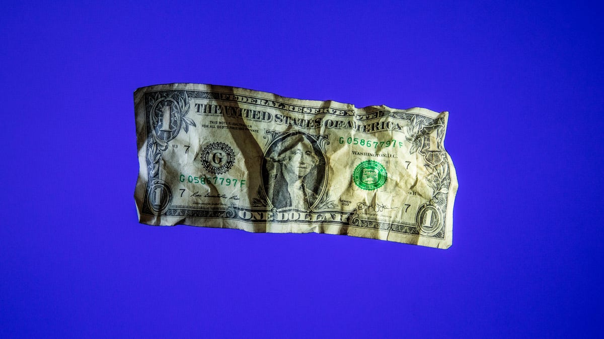 A wrinkled wrinkled dollar bill