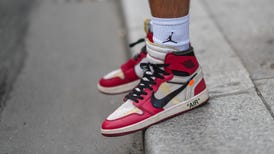 A red pair of Jordan 1 sneakers made in collaboration with streetwear brand Off-White