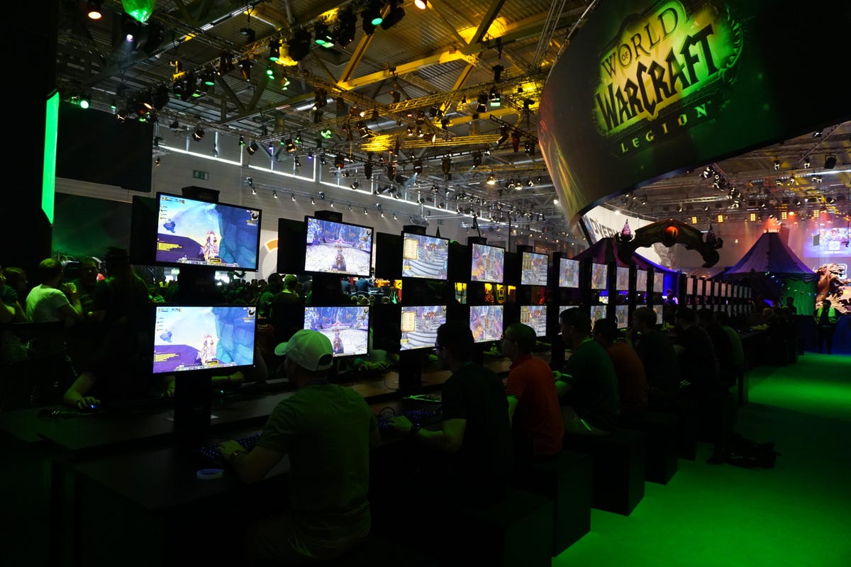 World of Warcraft fans battle in front of computer screens.