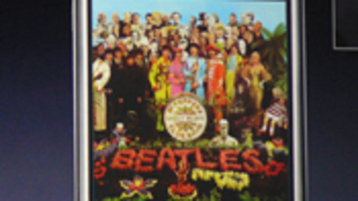 Photo of iPhone with Beatles cover at Macworld
