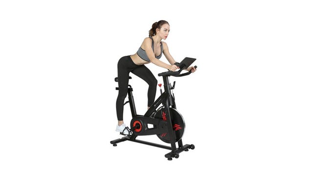 Woman riding Finer Form Indoor Exercise Bike