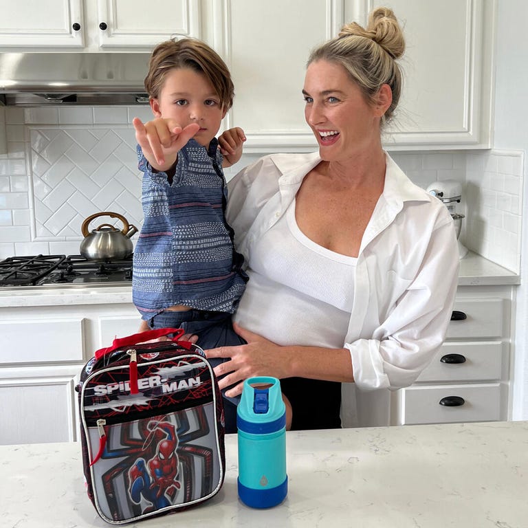 Collette Wixom in the kitchen with one of her sons.
