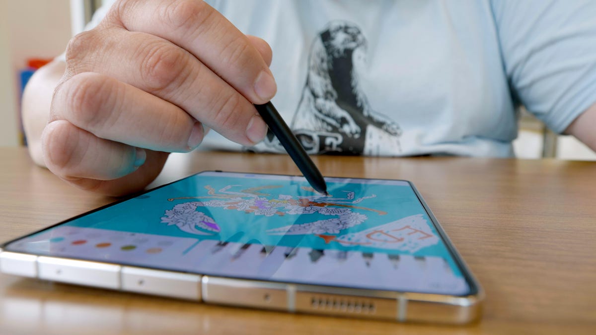 A Galaxy Z Fold 5 with an S Pen being used to draw on it