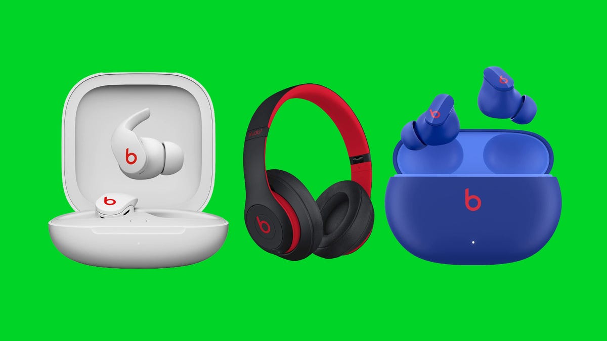 Several different models of Beats headphones and earbuds are displayed against a green background.
