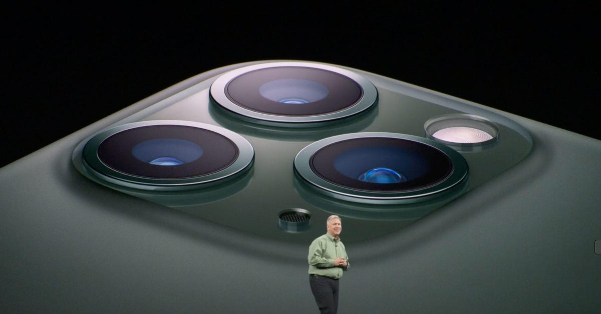 Apple marketing chief Phil Schiller shows off the iPhone 11 Pro's three cameras.