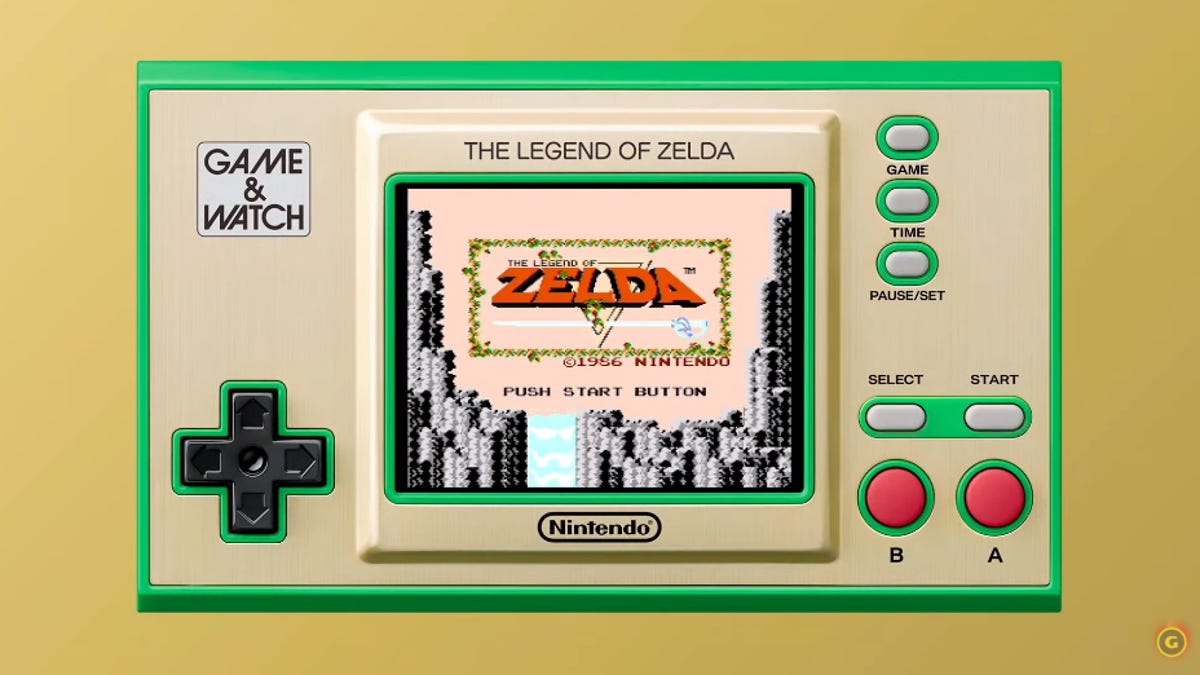 A Zelda Game and Watch handheld console against a yellow background.
