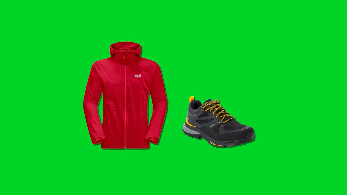 A red jacket and a black boots on a green background