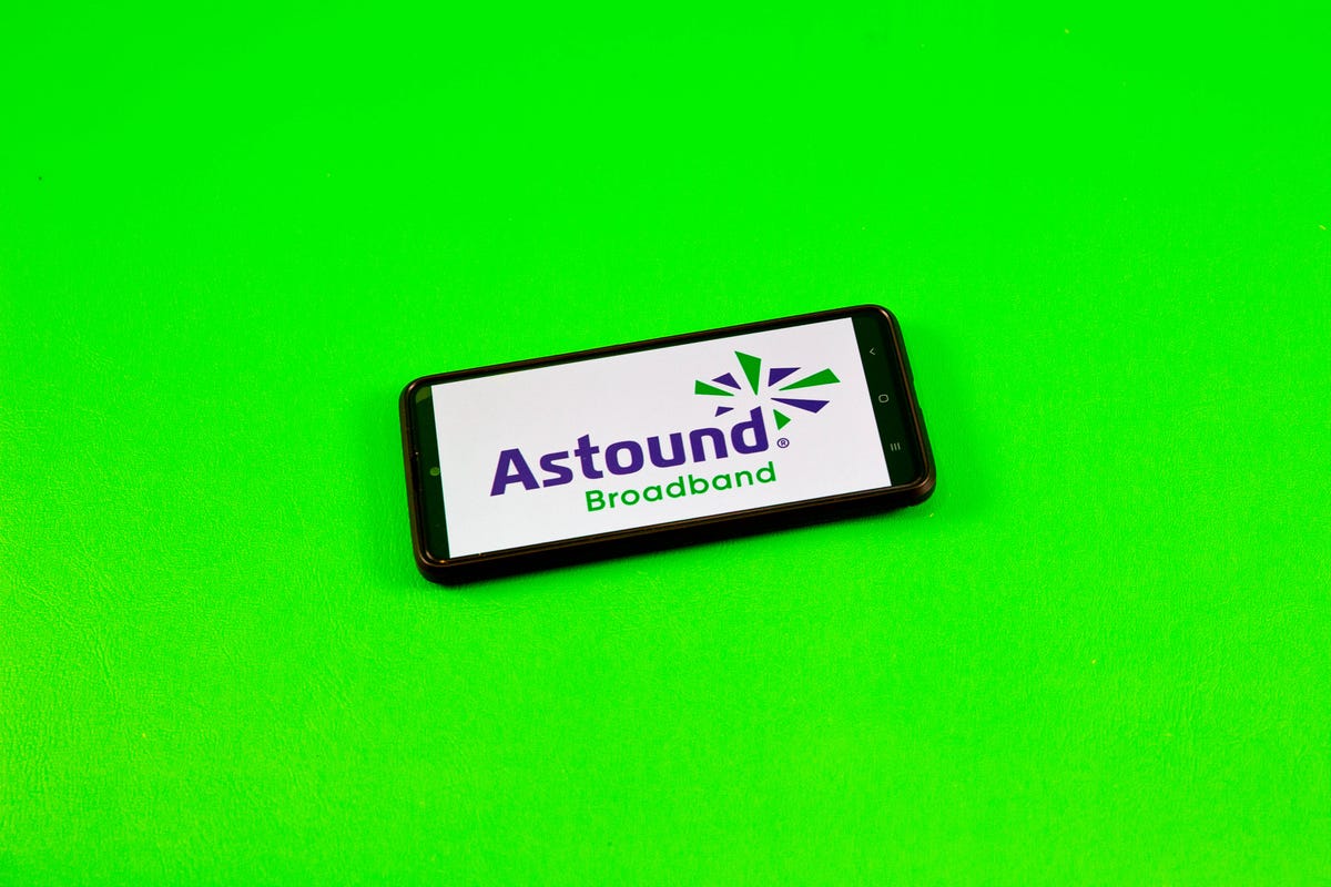 Astound Broadband logo on a phone with a green background