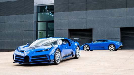 Bugatti Centodieci and Bugatti EB110 GT parked outside