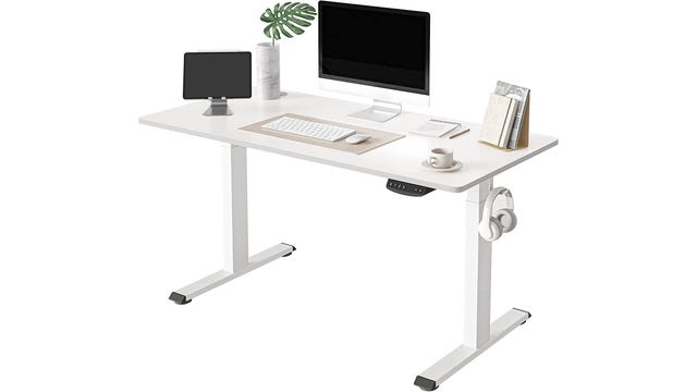 Bright white standing desk with 2 monitors