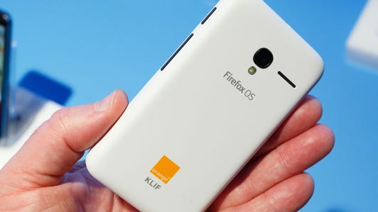 The Orange Klif has a rounded-corner design and a white body. Along one edge are the power button and volume rocker. On the back is a 2-megapixel camera with an LED flash.