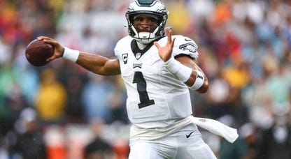 Jalen Hurts sets to throw a pass on the run for the Philadelphia Eagles