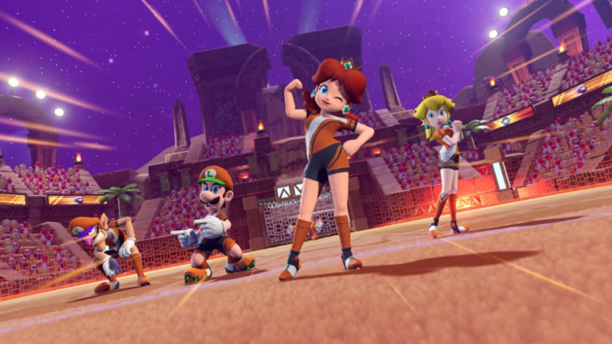Daisy standing with Waluigi, Luigi, and Peach
