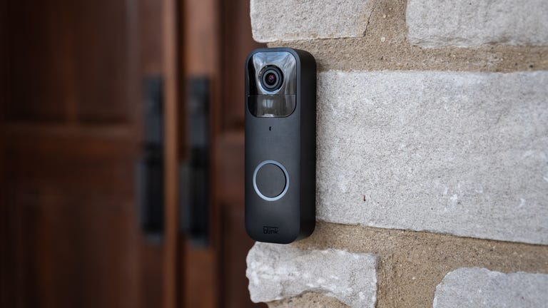 a Blink video doorbell positioned outside of a house