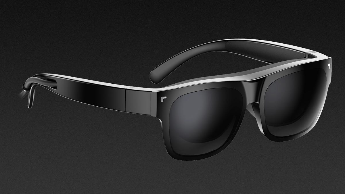 TCL NXTWear Air glasses are a wearable display that plugs into devices via a USB-C cable (seen coming from the right temple).