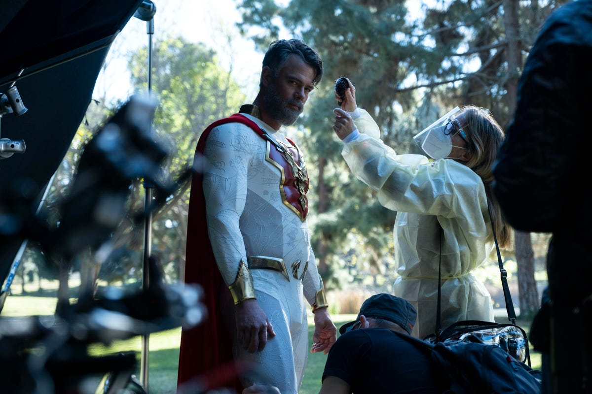 Josh Duhamel with cape and Covid precautions during reshoots.