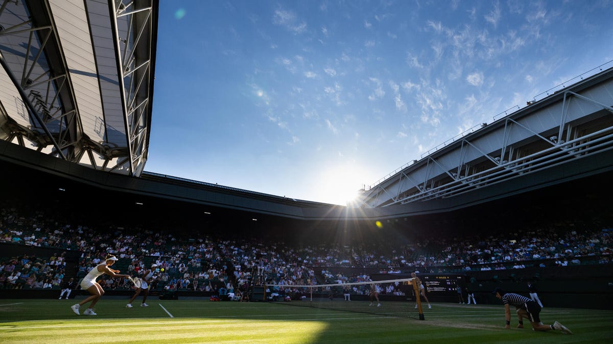 Side on image of Elise Mertens of Belguim and Shuai Zhang of China and Barbora Krejcikova and Katerina Siniakova both of the Czech Republic in action during the Ladies doubles Finals at The Wimbledon Lawn Tennis Championship