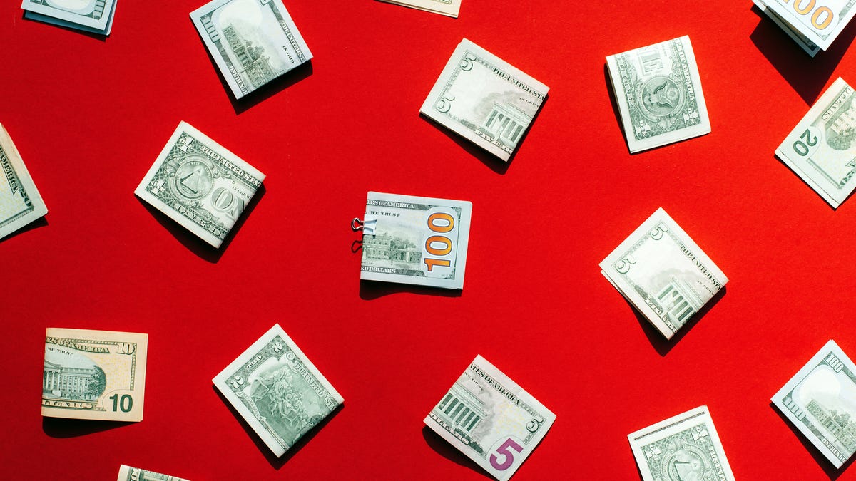dollar bills on a red background