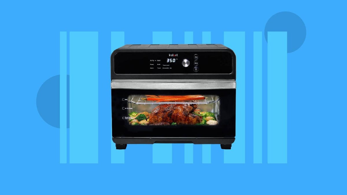 A black Instant Pot air frying toaster oven against a blue background.