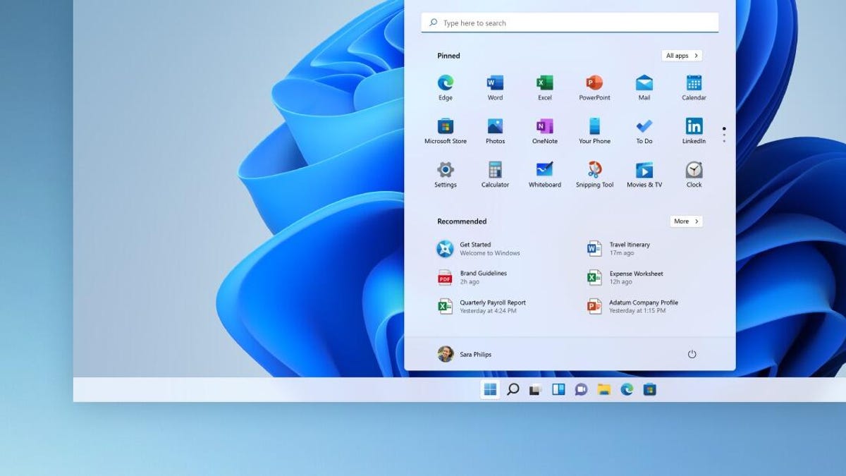 a screenshot of the Windows 11 Start menu popped up on an abstract blue background