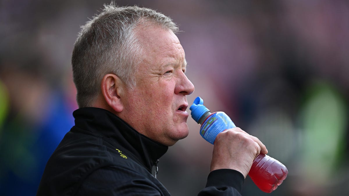 Side-on image of Sheffield United manager Chris Wilder drinking from a bottle.