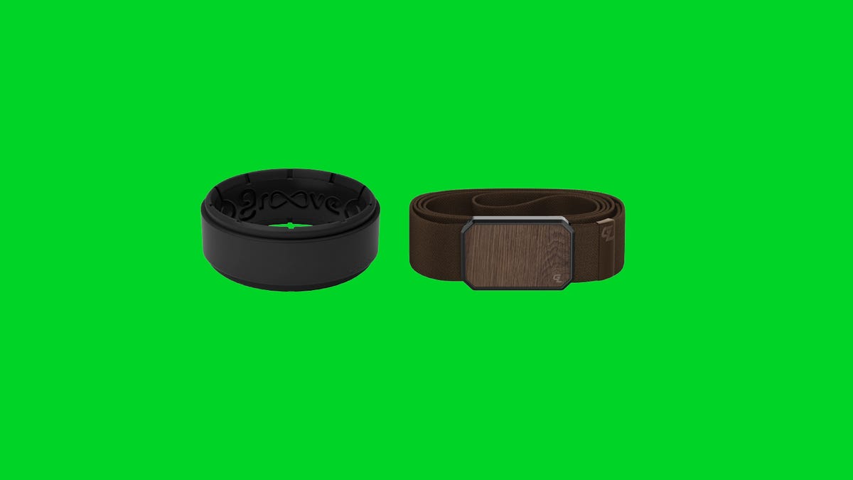 A black ring and brown belt on a green background