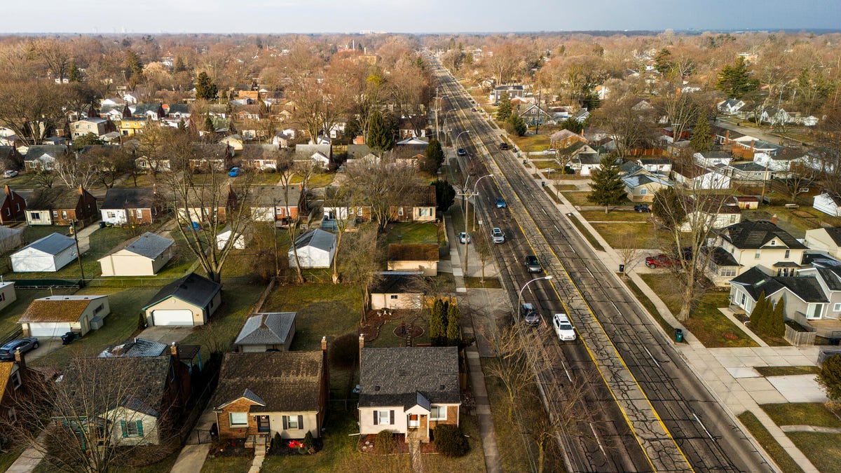 overhead view of houses and trees in winter