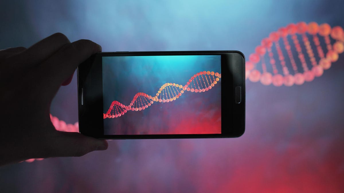 DNA double helix strand viewed with smartphone