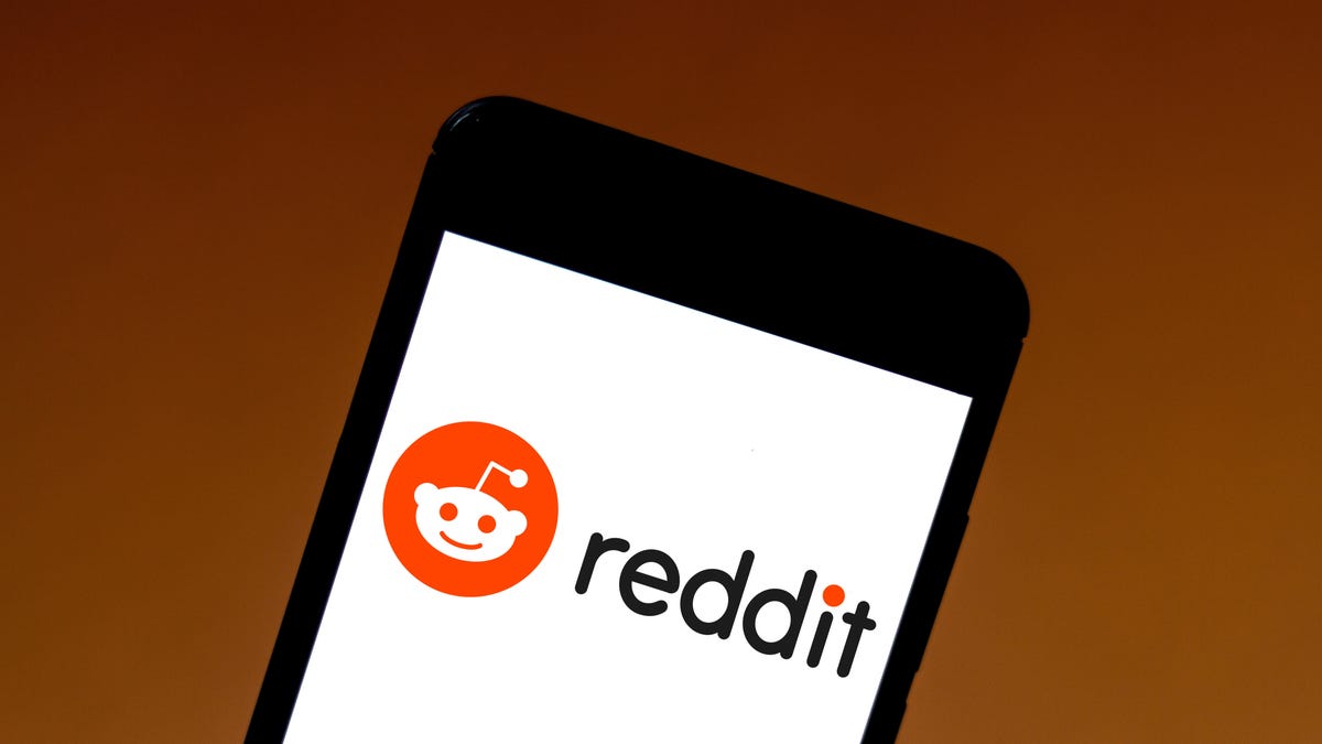 In this photo illustration the Reddit logo is seen displayed