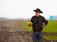 <p>Adam Savage holds the remote controller and is ready to launch the Panjandrums' first test on his new show, Savage Builds.&nbsp;</p>