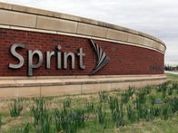 OVERLAND PARK, KS - APRIL 15:  A sign is seen in front of the Sprint Nextel operational headquarters after Dish Network made a $25.5 billion bid for the company on April 15, 2013 in Overland Park, Kansas. The satellite TV provider's unsolicited offer comes at a time when Sprint needs a cash infusion to avoid bankruptcy. Sprint is already considering a previous 20.1 billion bid from Japanese tech company Softbank.