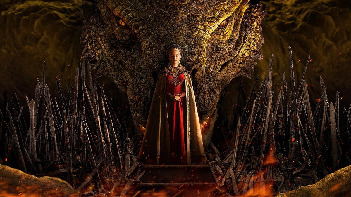 Rhaenyra Targaryen in regal attire in front of a glowering dragon