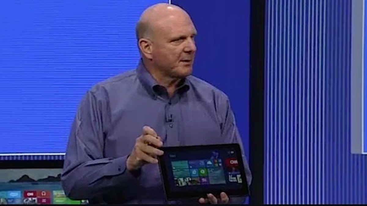 Steve Ballmer flourishes a Lenovo ThinkPad Helix hybrid tablet-laptop at the Build Conference Wednesday. He mocked the dedicated tablet as unusable and/or inefficient.