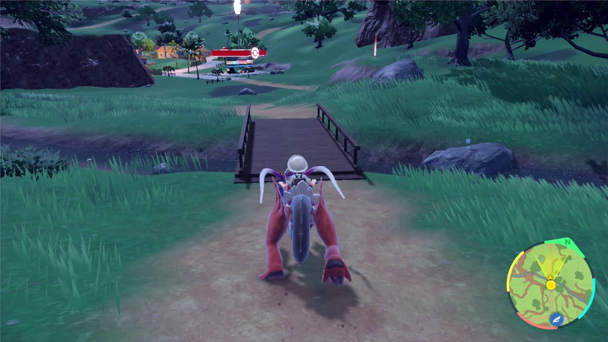 A trainer rides Koraidon in Pokemon Scarlet and Violet's open world