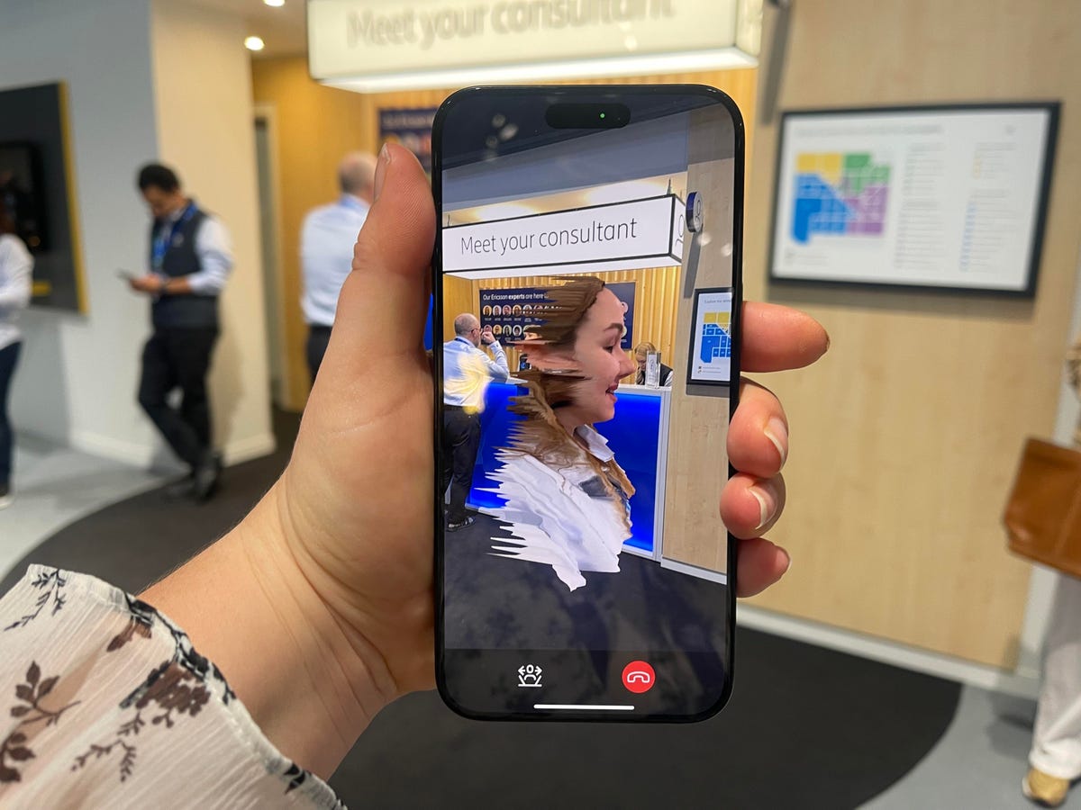 Phone screen showing hologram woman