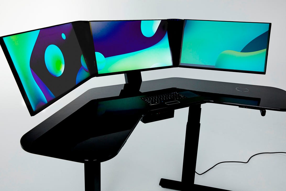 This smart desk has a built-in computer, scanner and wireless earbuds