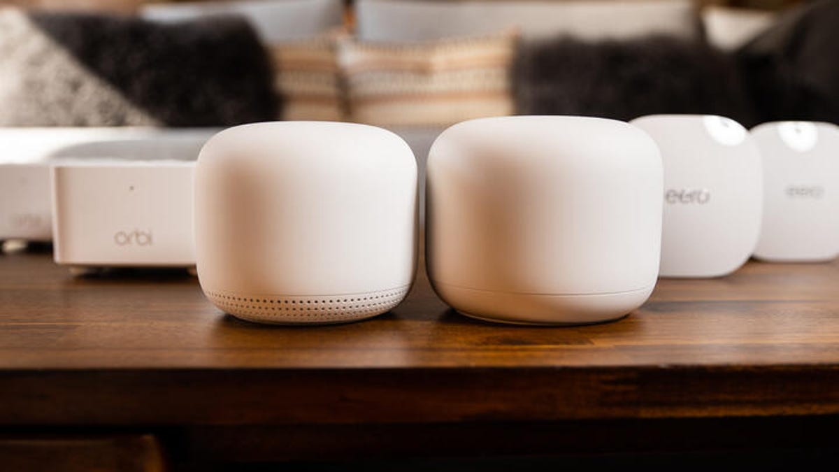 Our top picks for mesh Wi-Fi routers this year in a row, with the Google Nest in the center.