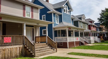 a row of single family homes with verandas