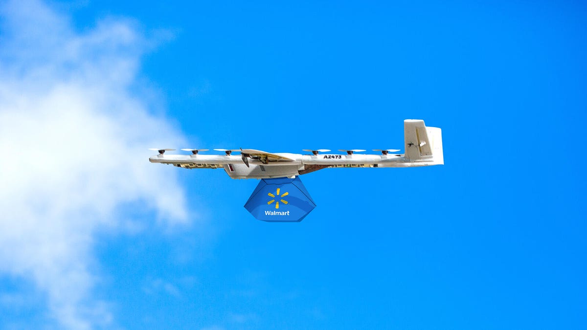A delivery drone from Alphabet&apos;s Wing subsidiary carries a package from retail giant Walmart