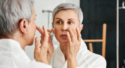 Woman applying skincare