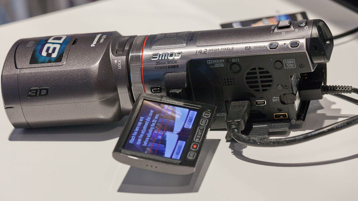 Panasonic&apos;s 3D-capable camcorder, shown here with its detachable 3D lens module, can show dual images on its screen.