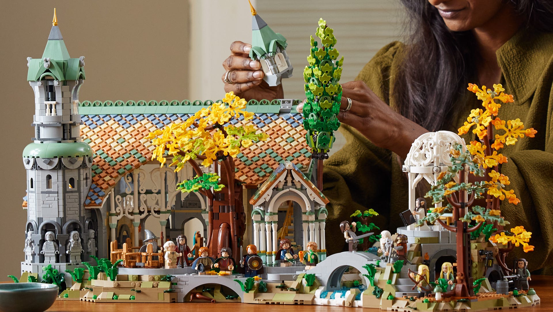 Fully build Lego Lord of the Rings Rivendell set shows a colorful selection of bricks in the form of Elrond's elven stronghold. Lego trees, a tower and a large building feature in the set.