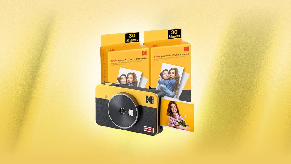 A Kodak instant camera and photo sheets against a yellow background.